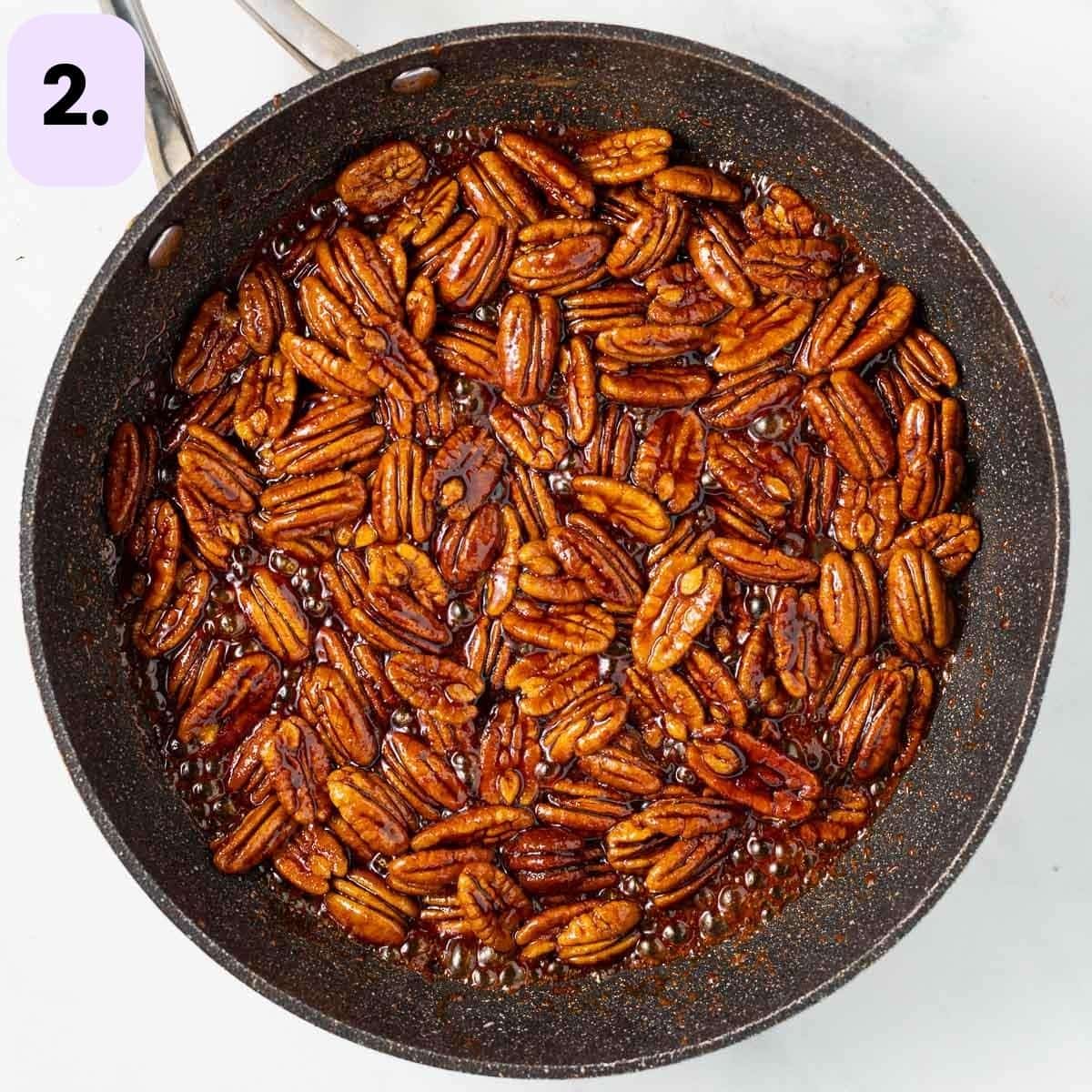 pecans candying in a pan