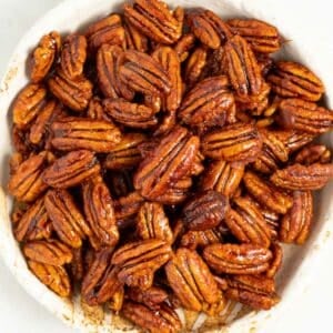 a bowl of candied pecans