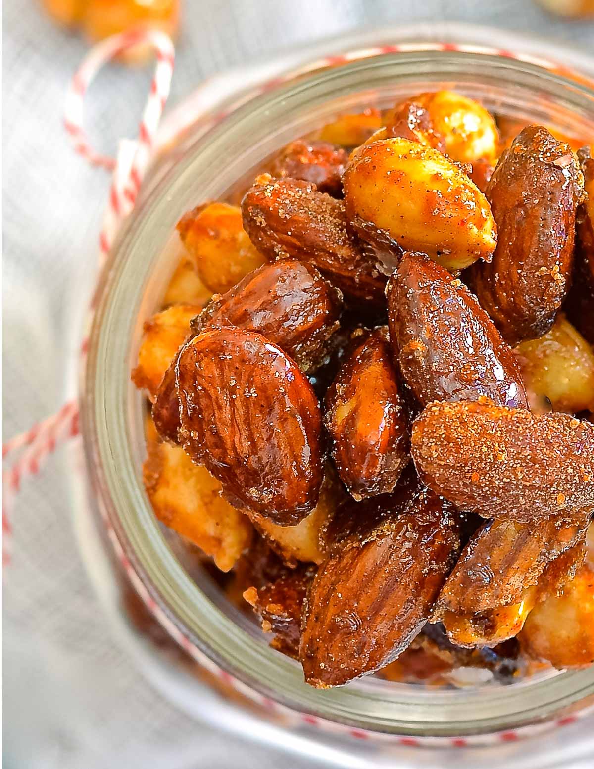 close up of candied nuts in a jar
