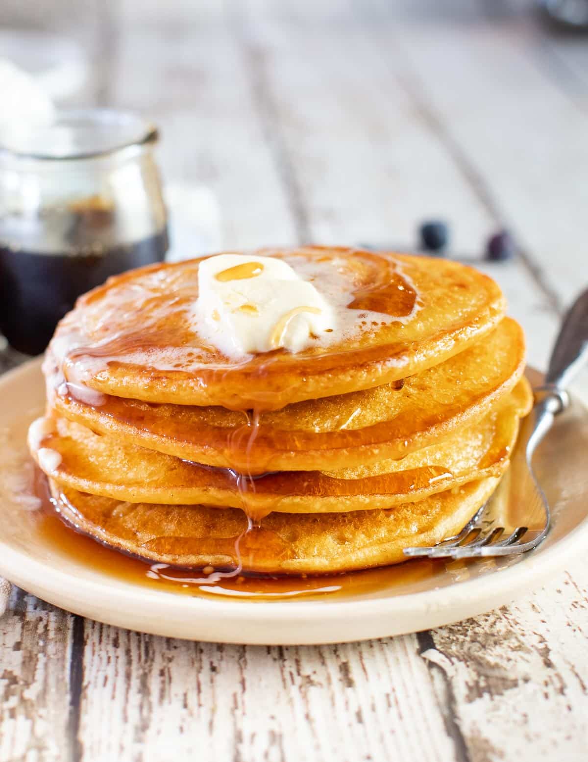 corn flour pancakes with butter and syrup