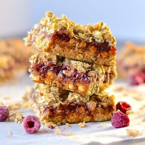 a stack of raspberry oat bars