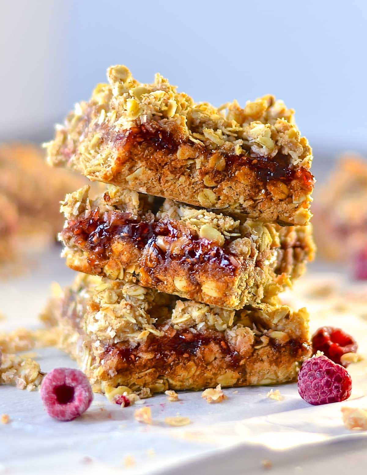 a stack of jammy raspberry oat bars