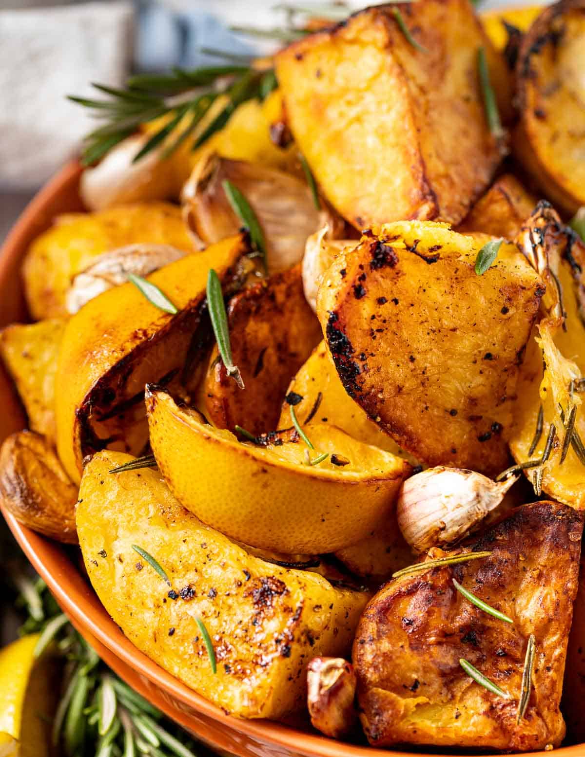 a bowl of lemon garlic roast potatoes