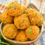 a bowl of curried carrot baked falafel