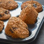 a tray of vegan blueberry bran muffins