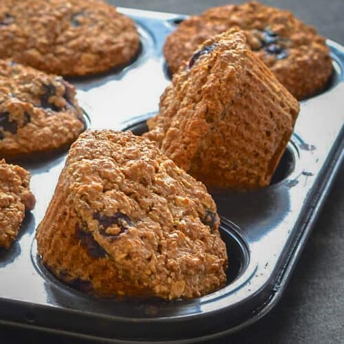 a tray of vegan blueberry bran muffins