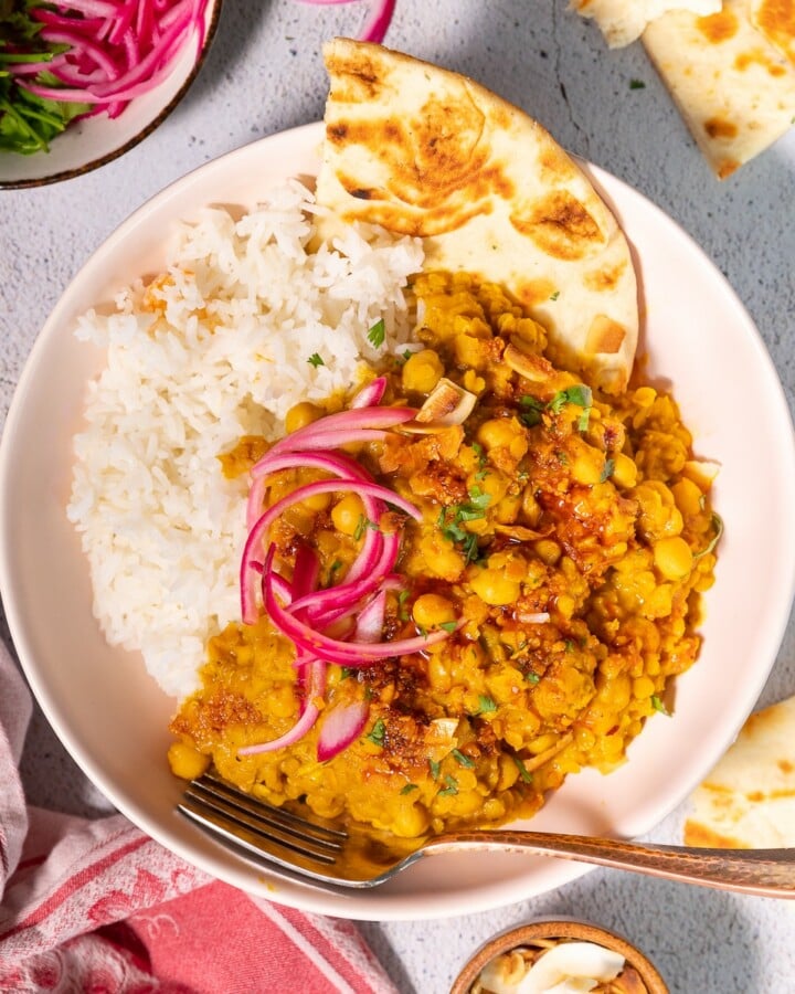 chickpea & lentil curry with rice and pickled red onions