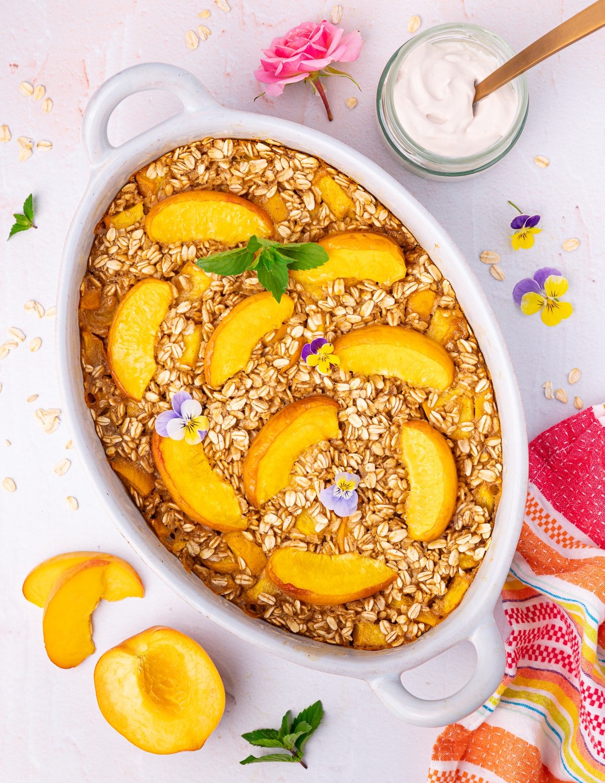 peach baked oatmeal in a ceramic dish