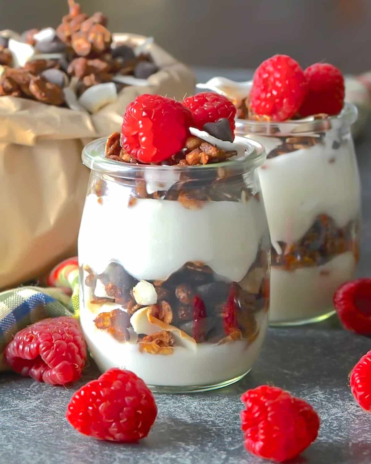 2 jars of chocolate coconut granola layered up with yogurt