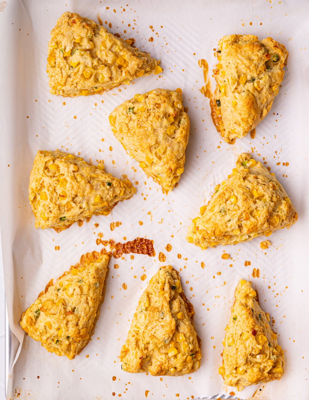 baked scones on a parchment paper lined tray 