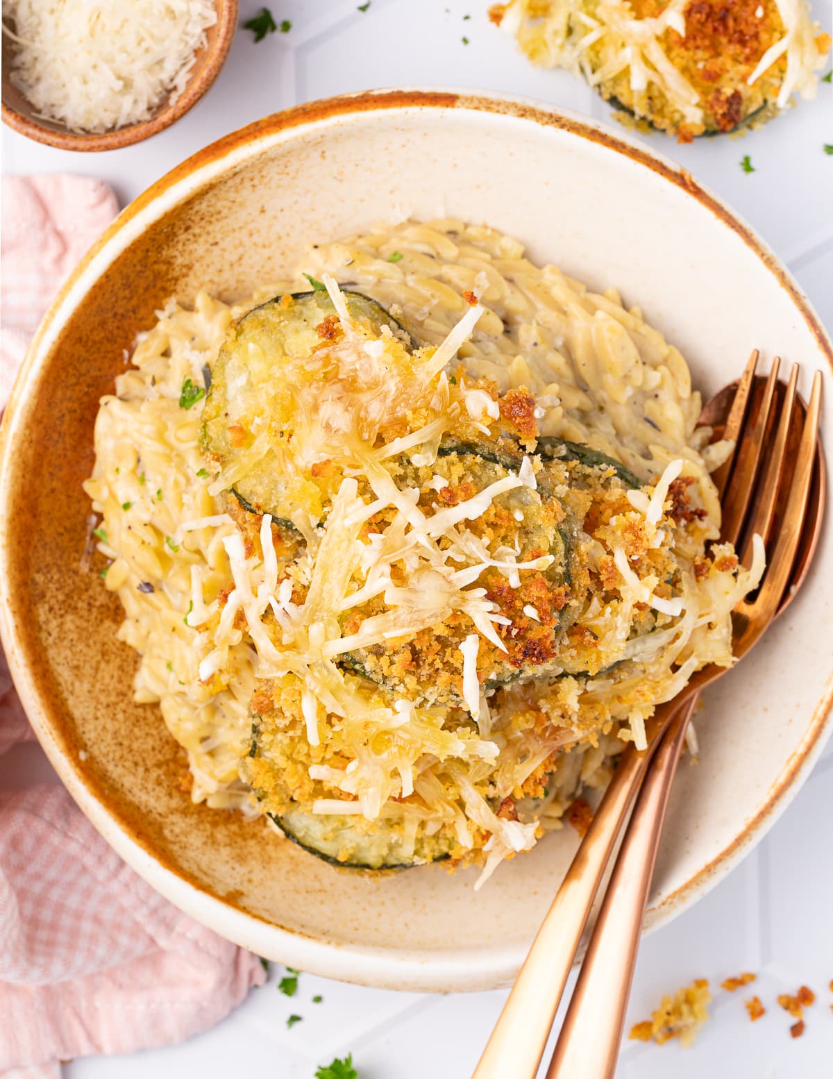 a bowl of creamy orzo with zucchini