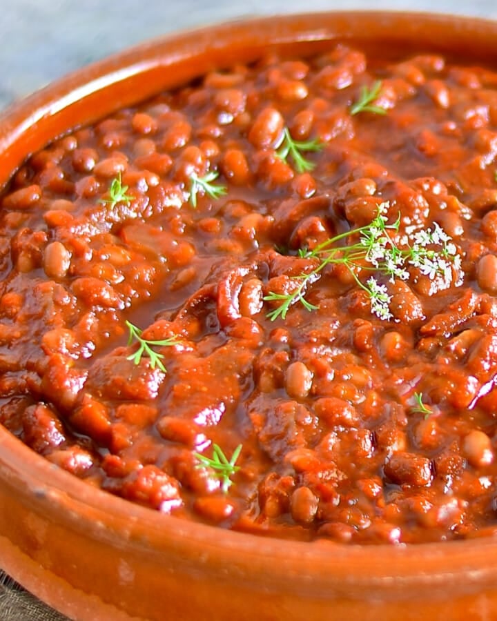 vegan baked beans in a terracotta dish