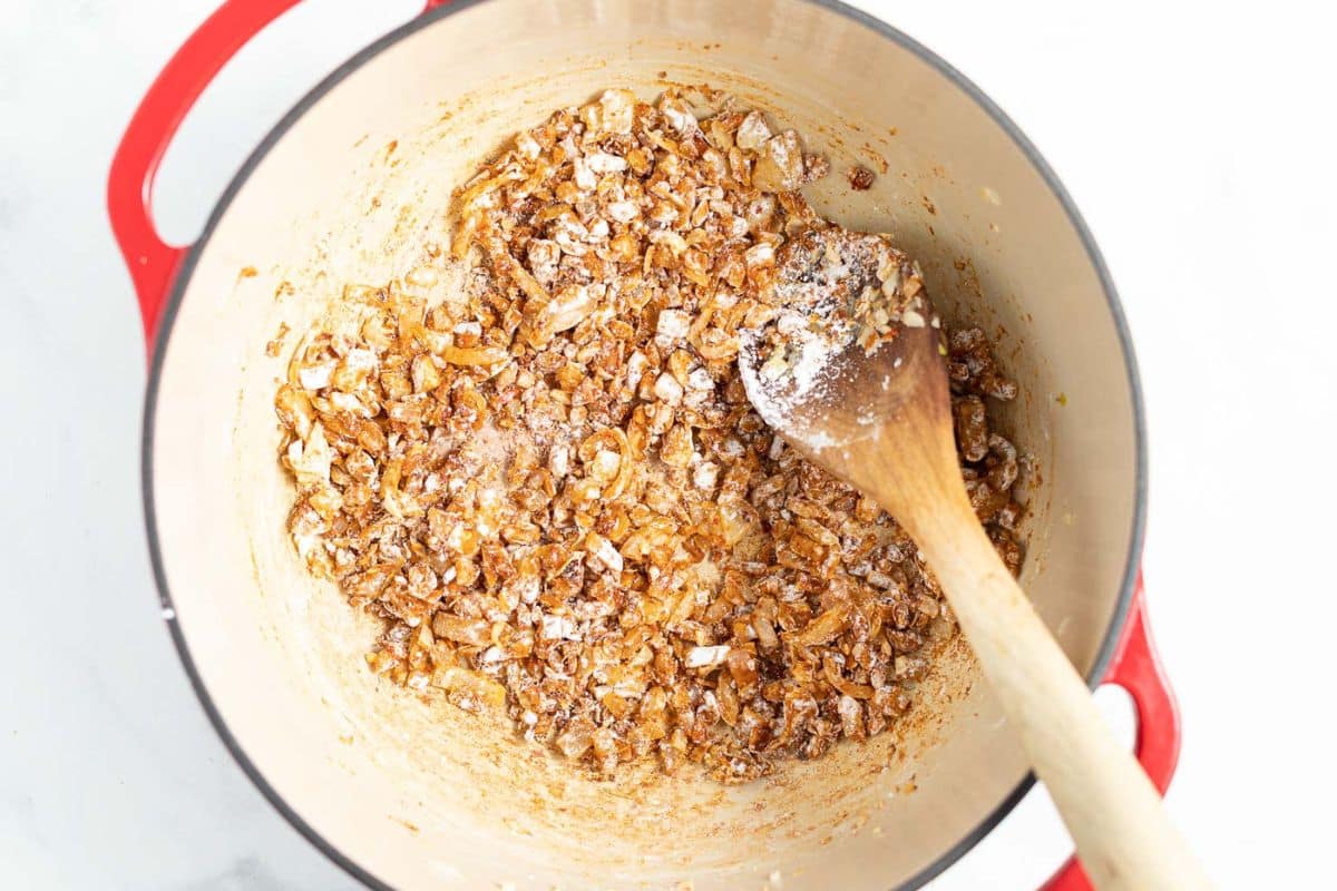 onions, garlic, spices and cornstarch in a Dutch oven