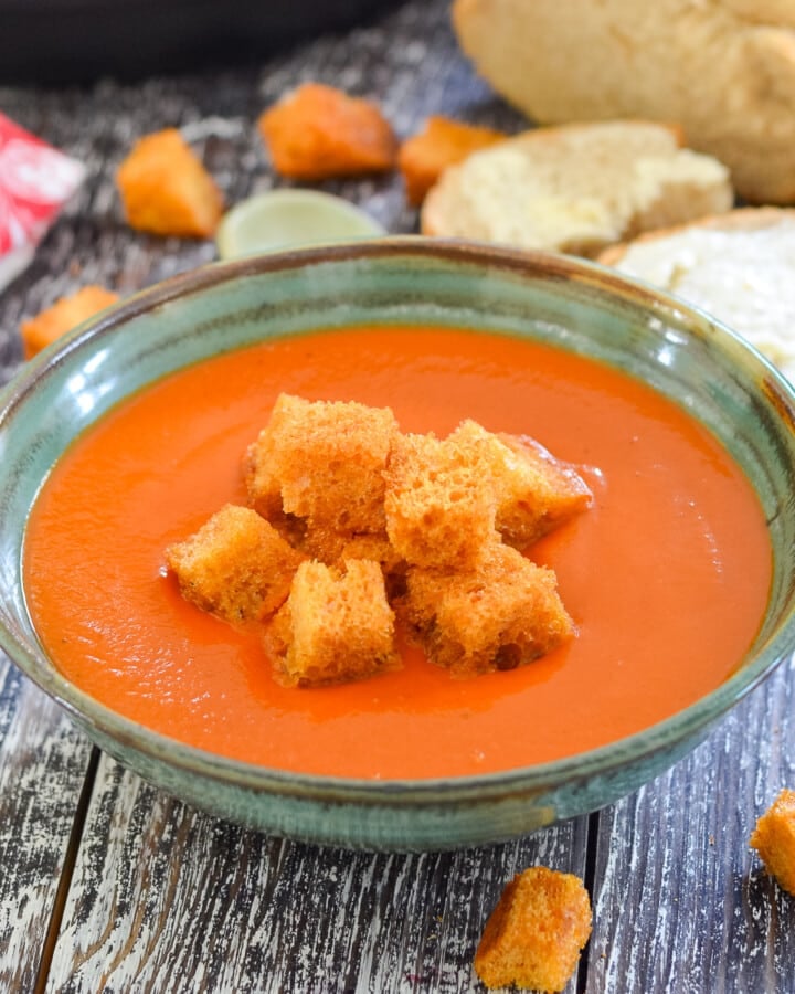a bowl of Instant Pot tomato soup with croutons