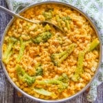 a pan of dairy-free mac and cheese with black pepper and broccoli