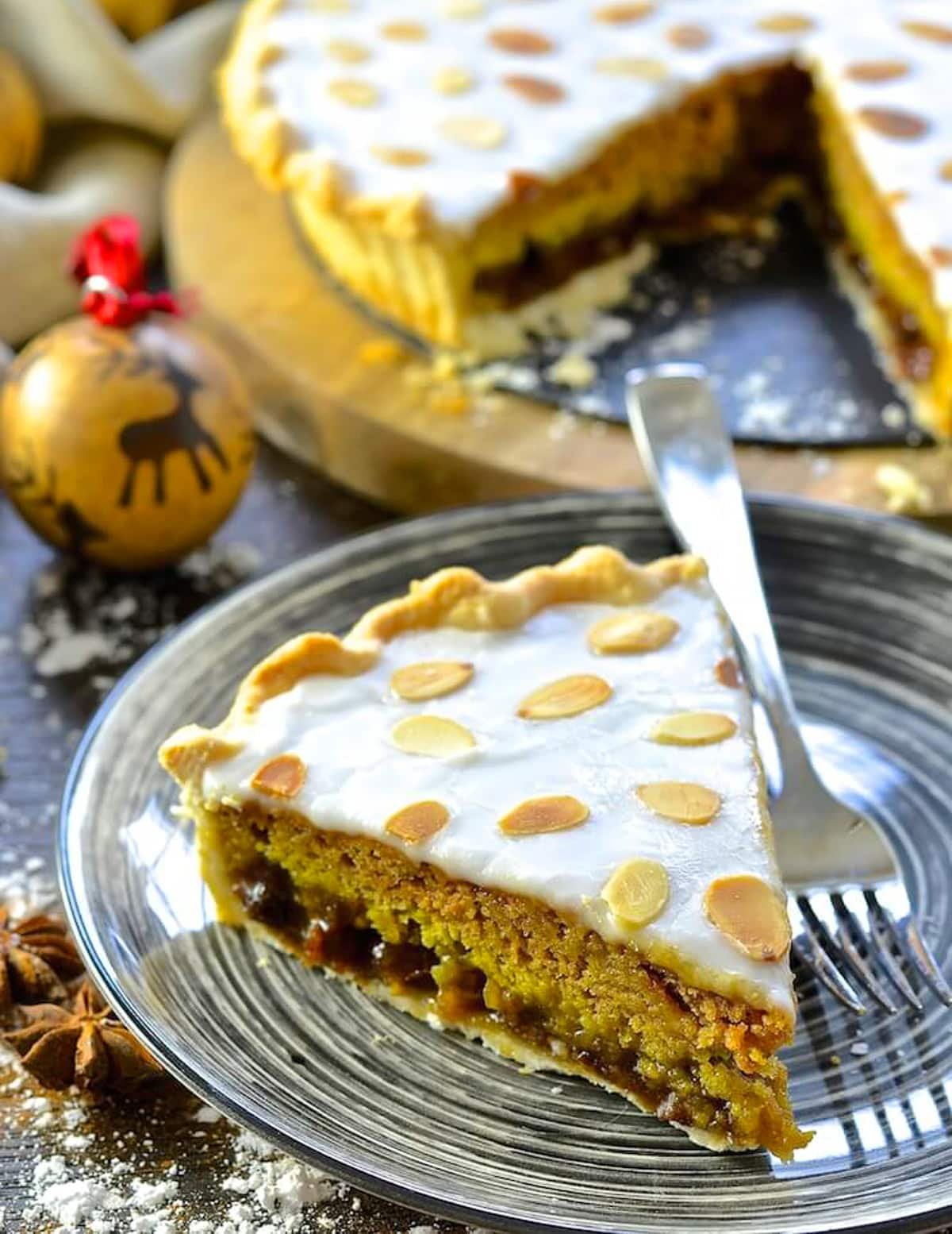 a slice of mincemeat tart on a black plate