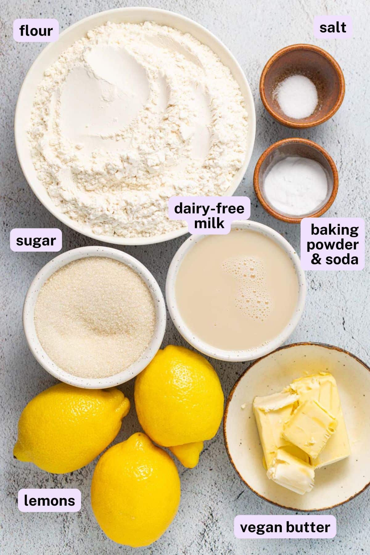 flour, salt, dairy-free milk, sugar, baking power and soda, lemons, and vegan butter. 