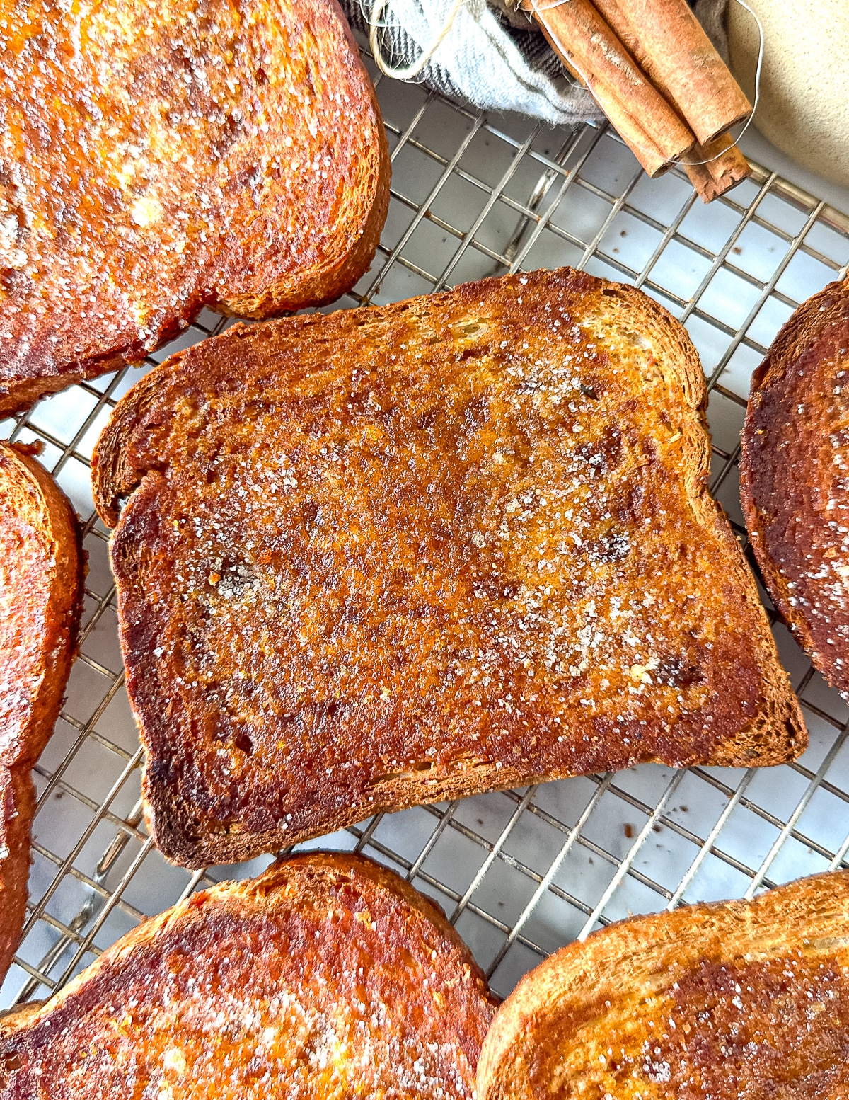 vegan pumpkin cinnamon toast on a wire rack