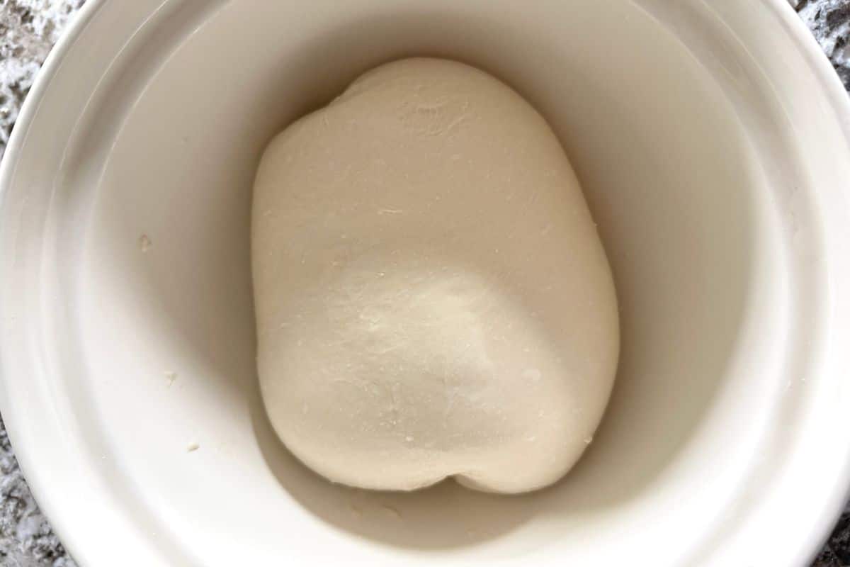 smooth, taut bread dough in a bowl