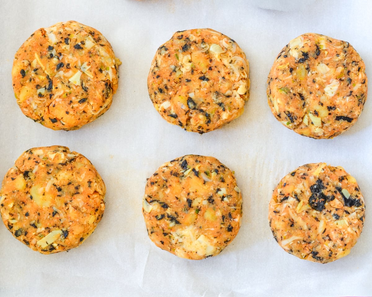 uncooked vegan crab cakes on a baking tray
