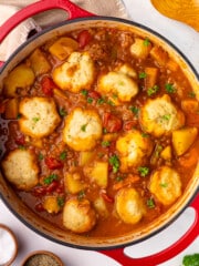 a pan of vegan beef & baked bean stew with dumplings