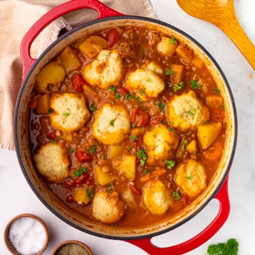 a pan of vegan beef & baked bean stew with dumplings