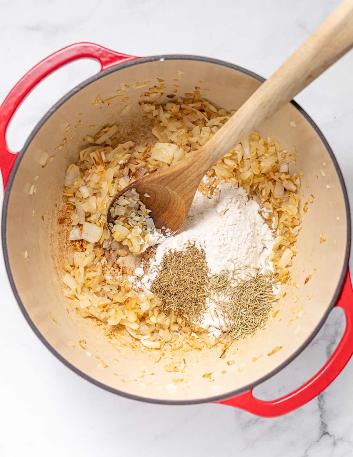 sautéed onions, garlic, herbs, and flour in a red dutch oven