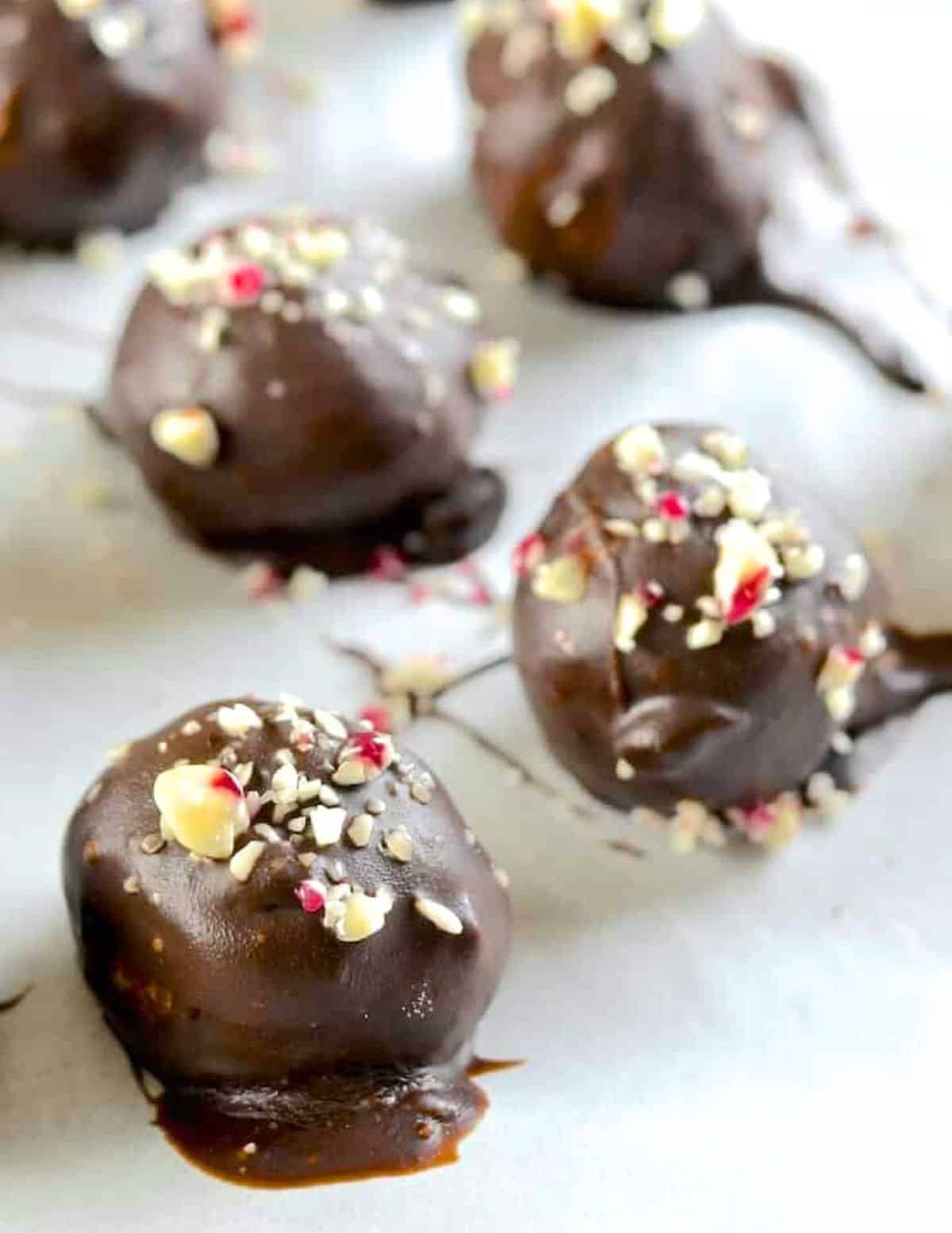truffles coated in melted dark chocolate and scattered with crushed candy canes