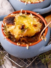 French Onion Soup in a small blue soup bowl