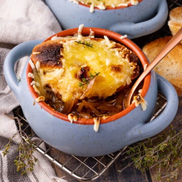 French Onion Soup in a small blue soup bowl