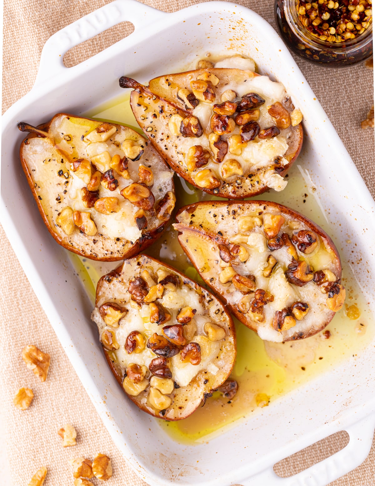 baked pears in a white casserole dish