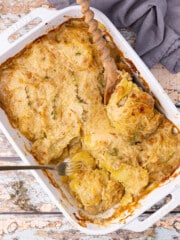 vegan scalloped potatoes in a white ceramic dish