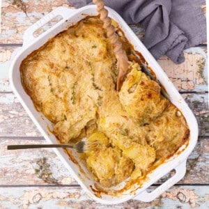 vegan scalloped potatoes in a white ceramic dish