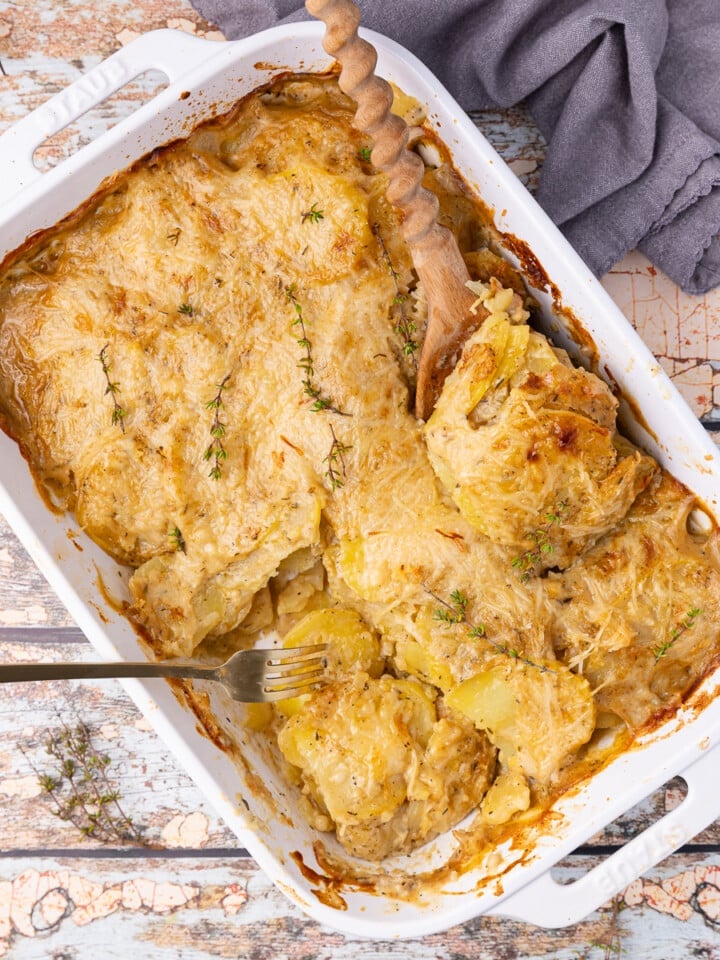 vegan scalloped potatoes in a white ceramic dish