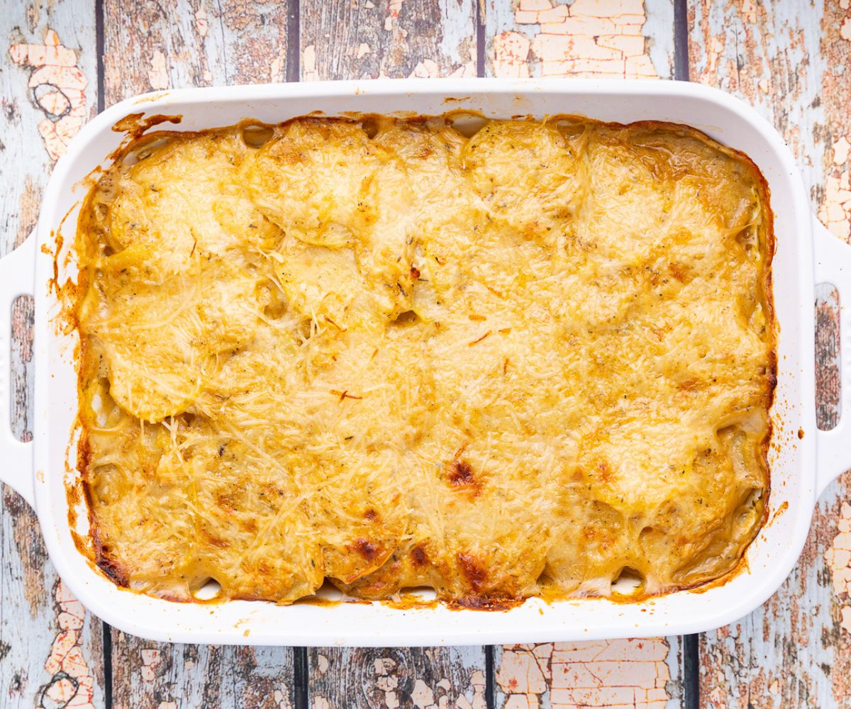 cooked, cheesy, vegan scalloped potatoes in a dish