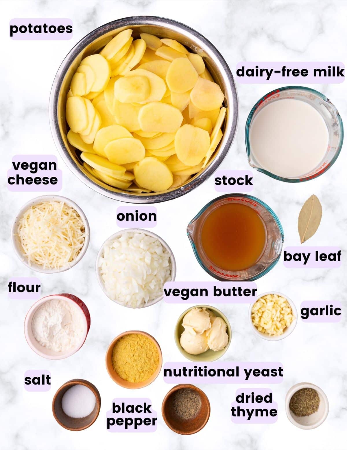 sliced potatoes, dairy-free milk, stock, vegan cheese, onion, flour, bay leaf, vegan butter, garlic, nutritional yeast, salt, pepper, thyme