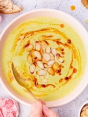 a bowl of broccoli almond soup