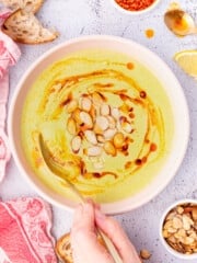 a bowl of broccoli almond soup