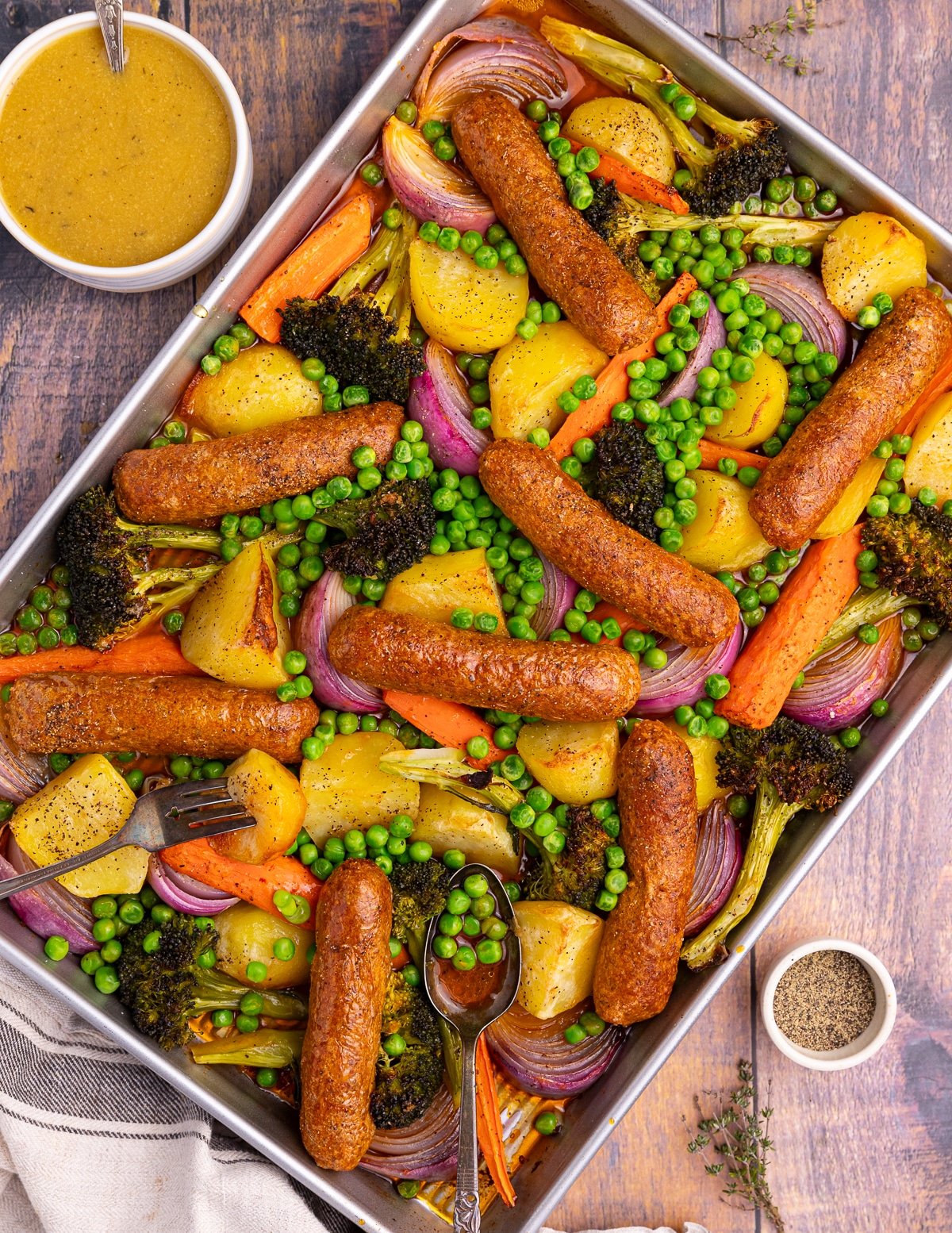 a sheet pan sausage dinner with gravy 