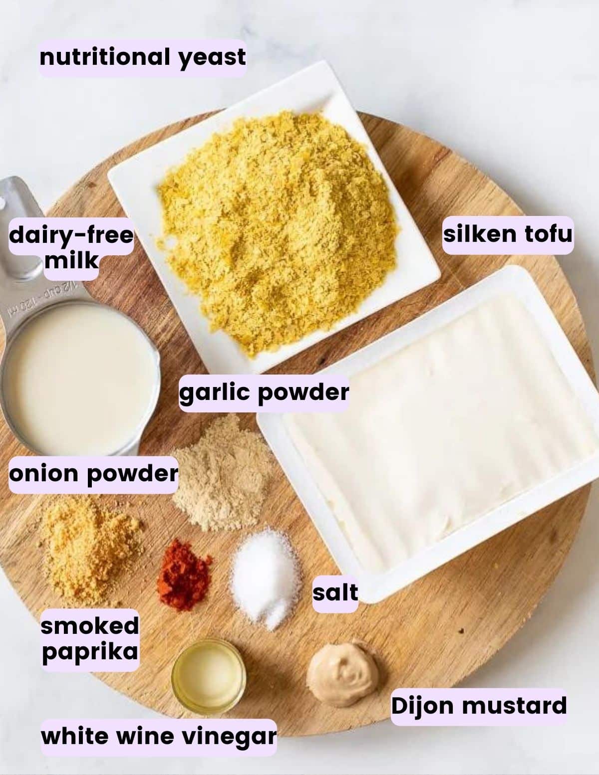 nutritional yeast, silken tofu, dairy-free milk, garlic powder, onion powder, smoked paprika, salt, dijon mustard