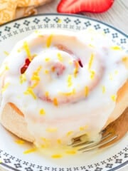 a strawberry lemon sweet roll on a plate