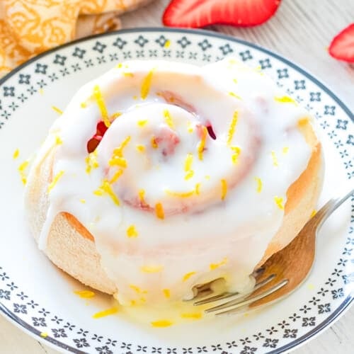 a strawberry lemon sweet roll on a plate