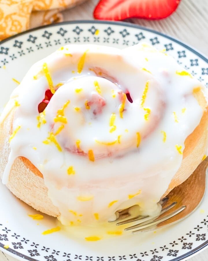 a strawberry lemon sweet roll on a plate