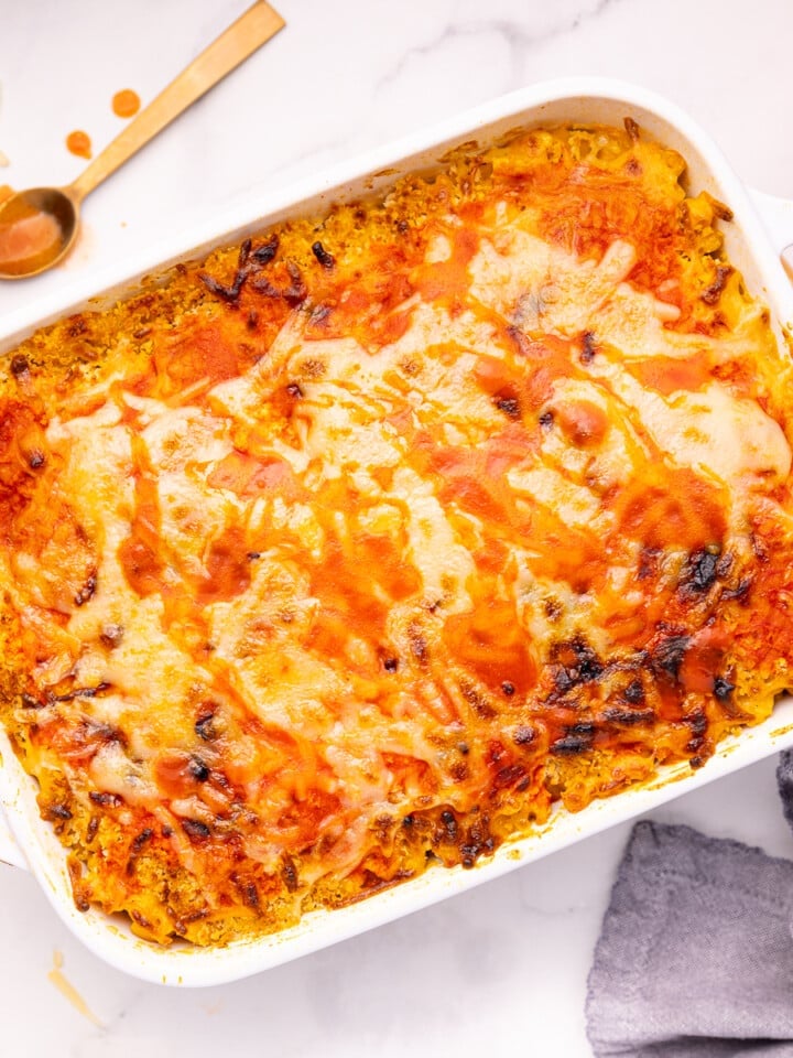 vegan buffalo mac and cheese in a white ceramic dish