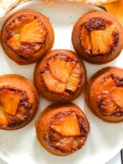 a plate of pineapple upside down cupcakes