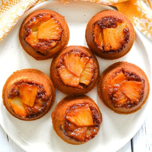 a plate of pineapple upside down cupcakes