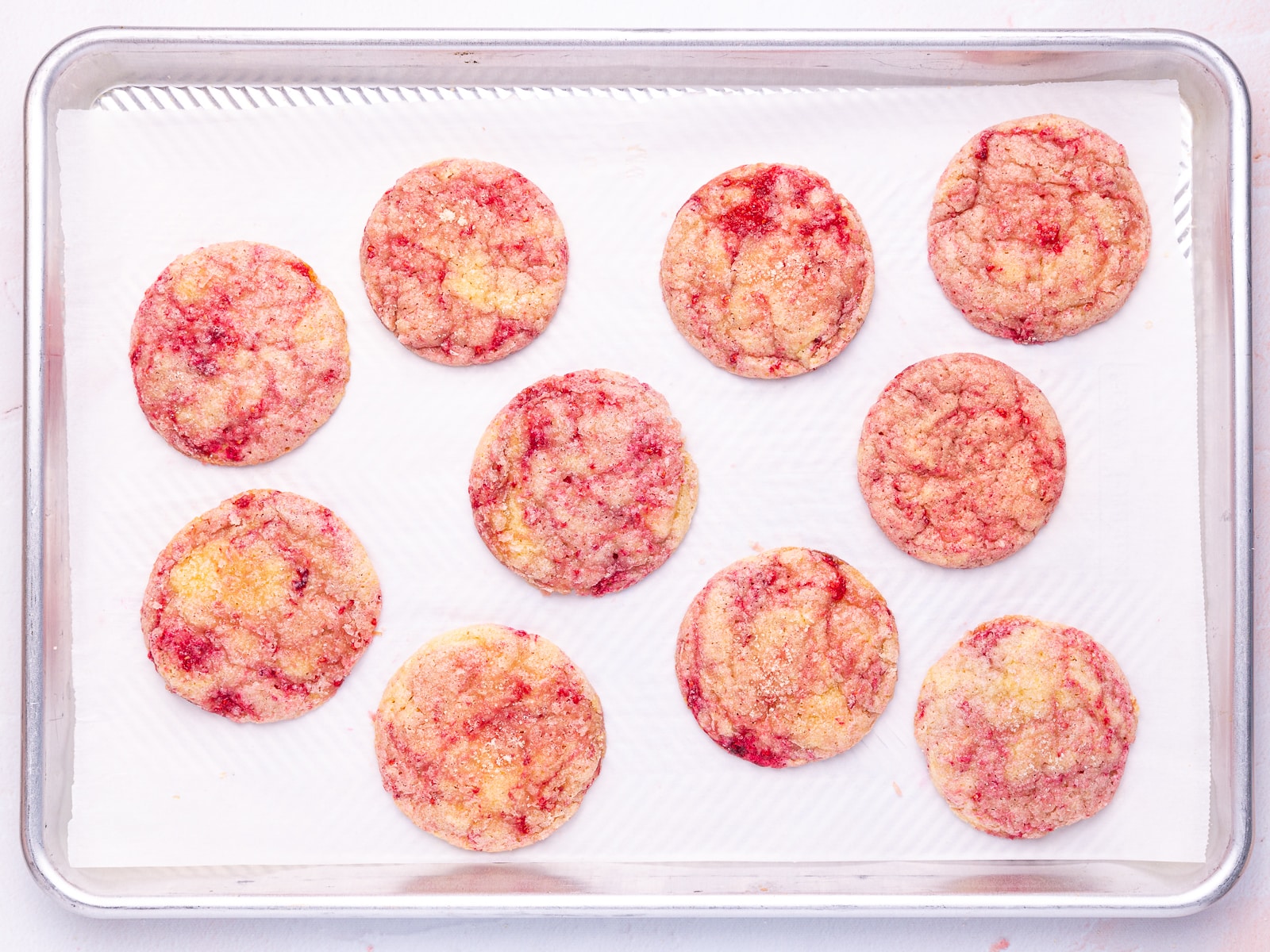 raspberry cookies on a baking tray