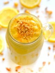 a lemon cheesecake smoothie with "cookie" crumbles on top.