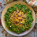 a bowl of massaged kale salad with savory granola