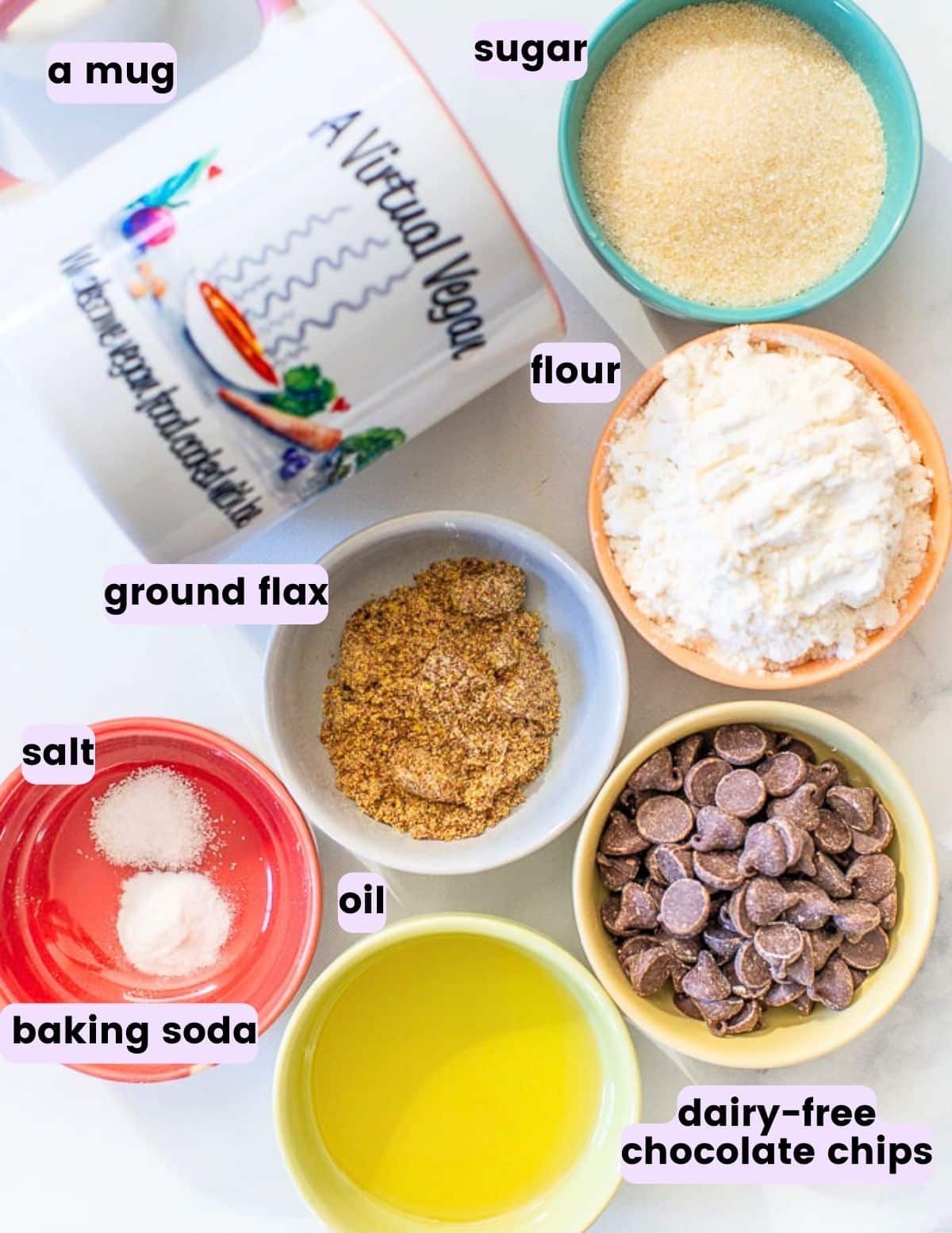 a mug, sugar, flour,ground flax, salt, baking soda, chocolate chips and oil. 